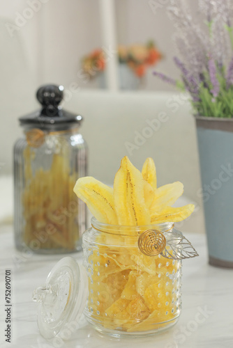 banana chips in a jar with blurred background