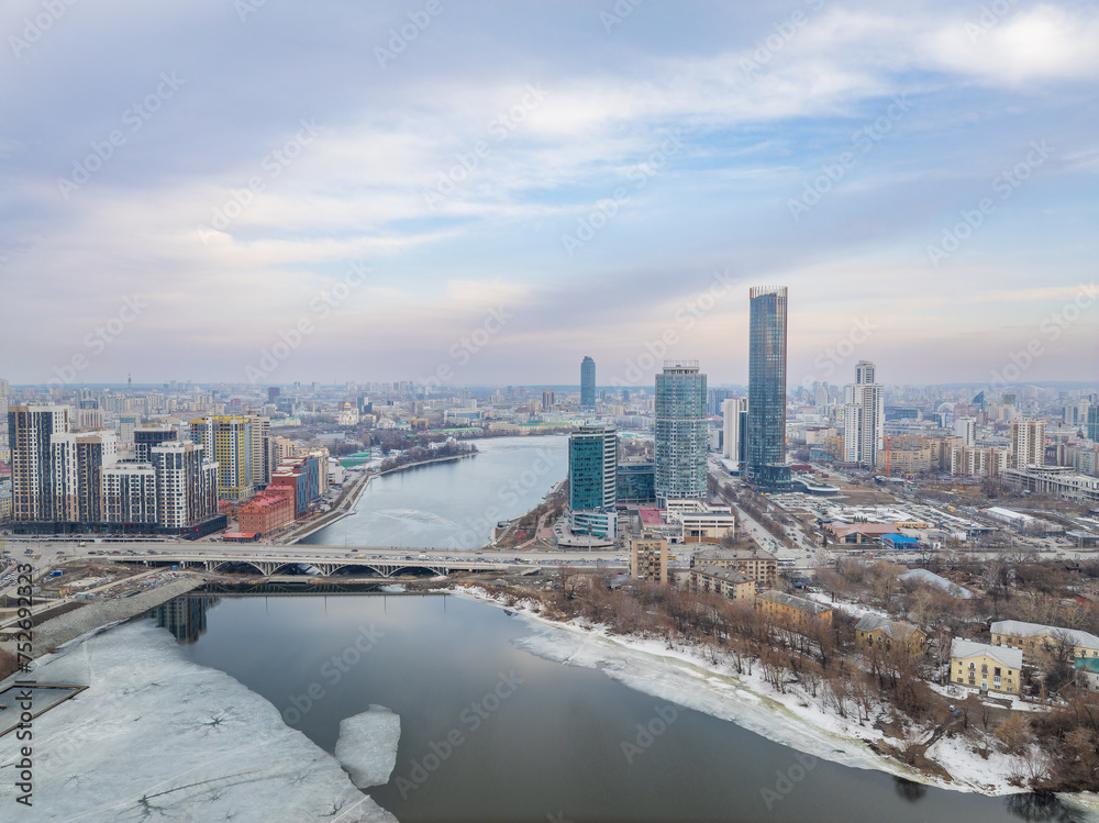 Fototapeta premium Yekaterinburg aerial panoramic view in spring at sunset. Yekaterinburg city and pond in spring or autumn.