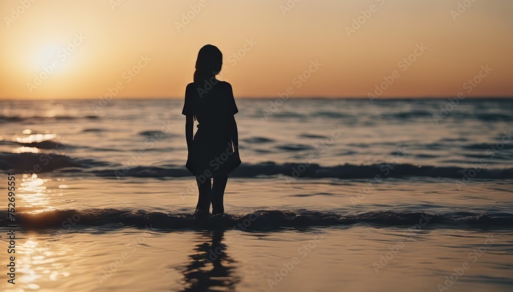 view of silhouette of a girl standing in the water on a beach as the sun goes down image background view of silhouette of a girl standing in the water on a beach as the sun goes down image background