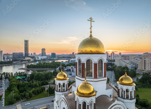 Summer Yekaterinburg and Temple on Blood in beautiful clear sunset.. Aerial view of Yekaterinburg, Russia. Translation of the text on the temple: Honest to the Lord is the death of His saints.