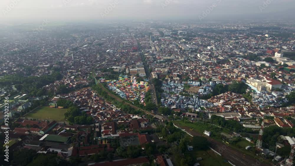 Bird's eye view video capturing the demographic landscape of an overpopulated urban area in Malang, East Java, Indonesia. Bird's eye view video capturing the demographic landscape of an overpopulated urban area in Malang, East Java, Indonesia.
