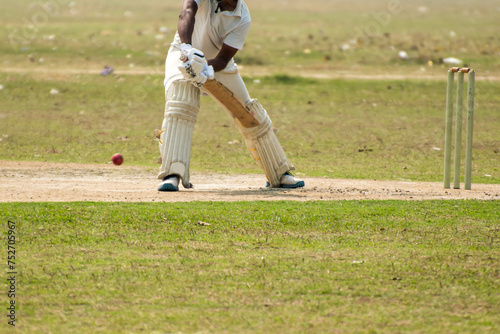 Cricket batsman is playing forward defensive stroke