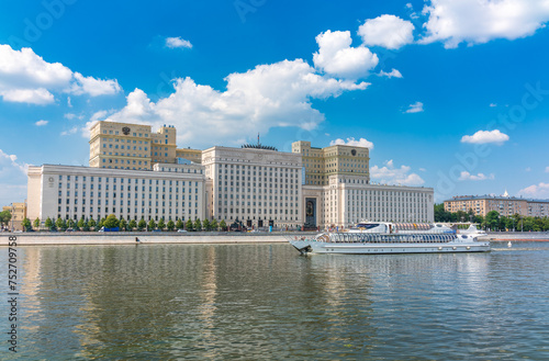 View of the Ministry of Defence of Russian Federation  and Moscow river embakment with cruise ships at sunset.