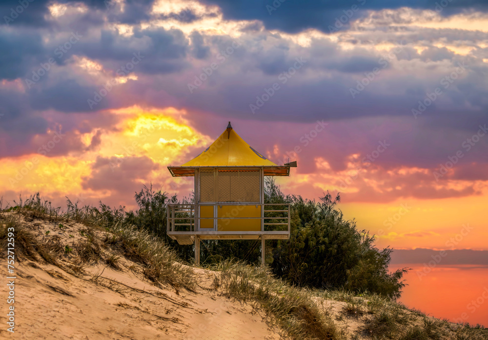 Lifesavers look out Queensland Australia at sunset