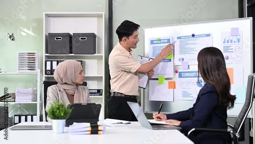 Wallpaper Mural Happy businesspeople while collaborating on a new project in an office. Group of diverse businesspeople using a laptop and tablet Torontodigital.ca