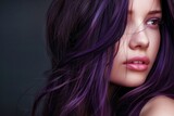 Portrait of a Young Woman With Vivid Purple Hair Against a Blurred Background