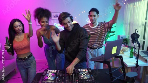 Professional DJ mixes music in the pub, Group of friends enjoying dancing at party.