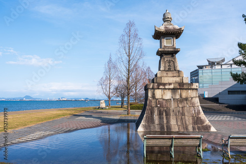 Ishiba tsu night light monument, on the shore of Lake Biwa. Otsu, Shiga Prefecture, Japan. Japanese translation 