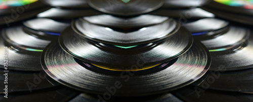 a black background of old vinyl records with reflections of jazz music photo