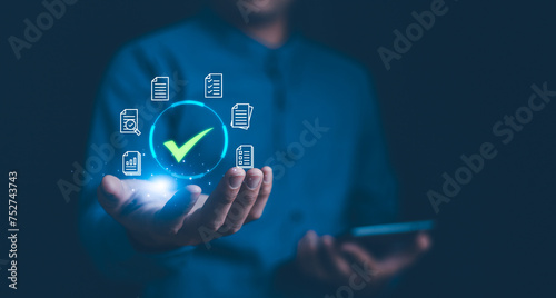 Obraz na płótnie Checkmark checklist concept. A professional interacts with showcasing a glowing checkmark surrounded by document icons, symbolizing successful task completion or verification in a digital workflow. w salonie