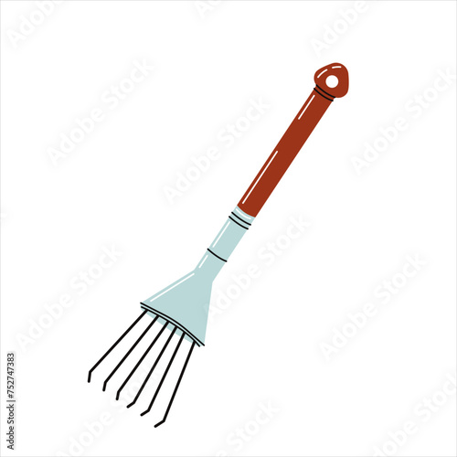 Small rake isolated on white background. Garden tool for loosening soil