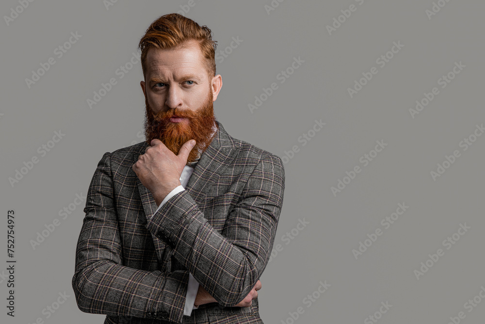 Man wear elegant formal menswear. Elegance of bearded man in formal suit. Tuxedo man in menswear isolated on grey. Redhead man in menswear tuxedo. Copy space Man wear elegant formal menswear. Elegance of bearded man in formal suit. Tuxedo man in menswear isolated on grey. Redhead man in menswear tuxedo. Copy space