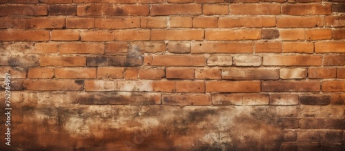 Warm hues on textured brick wall in shades of red and brown