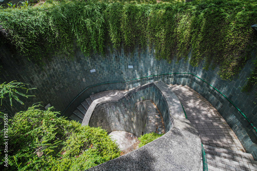 Photography The tunnel's spiral walkway leads to a ground entering at Fort Canning Park in Singapore