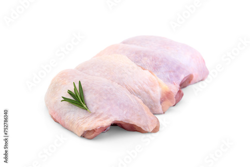 Raw chicken thigh with rosemary isolated on white background.