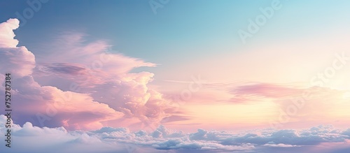 Dreamy Evening Sky in Soft Pink Hues with Fluffy Clouds on the Horizon