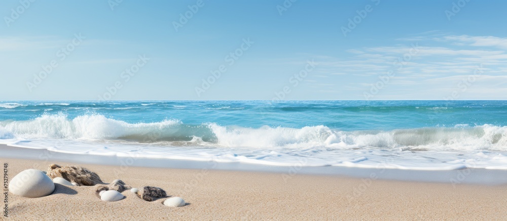 Obraz premium Majestic Wave Crashing onto a Serene Beach Shoreline at Sunset