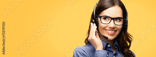 Contact Call Center Service. Customer support, sales agent. Caller answer phone operator businesswoman in headset. Portrait of woman wear glass spectacles. Isolated yellow wall background. Wide banner