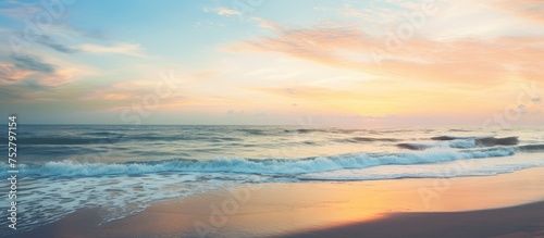 Serenity at the Seashore: Majestic Sunset Casting Golden Glow over Gentle Waves