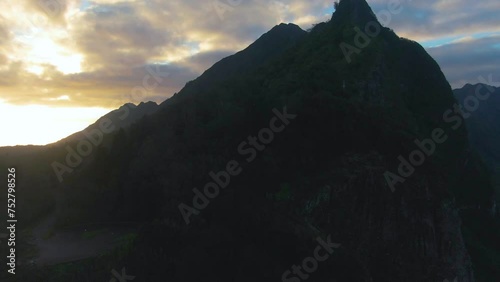 Aerial rising shot of Koolau mountain during beautiful sunrise, Hawaii, USA photo