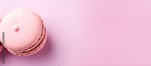 Two Vibrant Macarons Resting on a Soft Pink Background - Delicious French Desserts