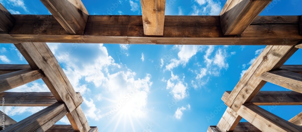 Fototapeta premium Rustic Wooden Pavilion under Blue Sky: Tranquil Outdoor Oasis in Nature