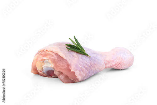 Raw chicken leg with rosemary isolated on white background.