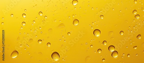 Vibrant Water Droplets on Bright Yellow Surface - Abstract Artistic Background
