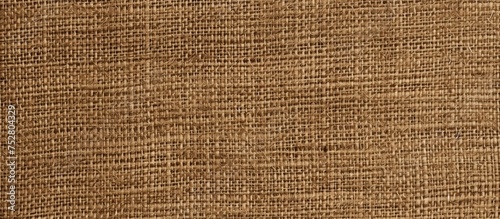 Detailed close up of a brown fabric texture, showcasing the intricate weaving pattern and rich color of the material.