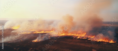 Intense Blaze Engulfs Countryside Field Creating a Powerful Fiery Spectacle © Ilgun