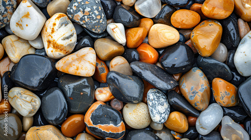 Pebbles background with black white orange and brown 