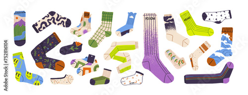 Stylish socks pairs set. Different patterned foot garments with geometric shapes, floral print. Colored fashion hosiery in sport, casual styles. Flat isolated vector illustration on white background