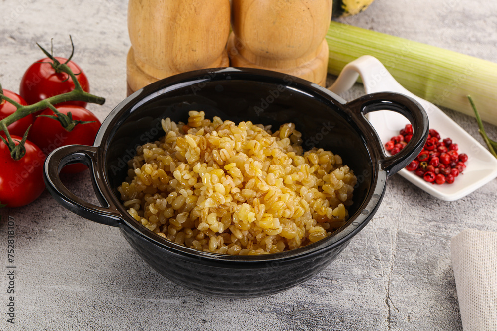 Boiled bulgur wheat in the bowl Boiled bulgur wheat in the bowl
