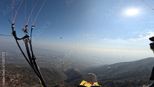 First Person Paragliding view. Paraglider in the mountains