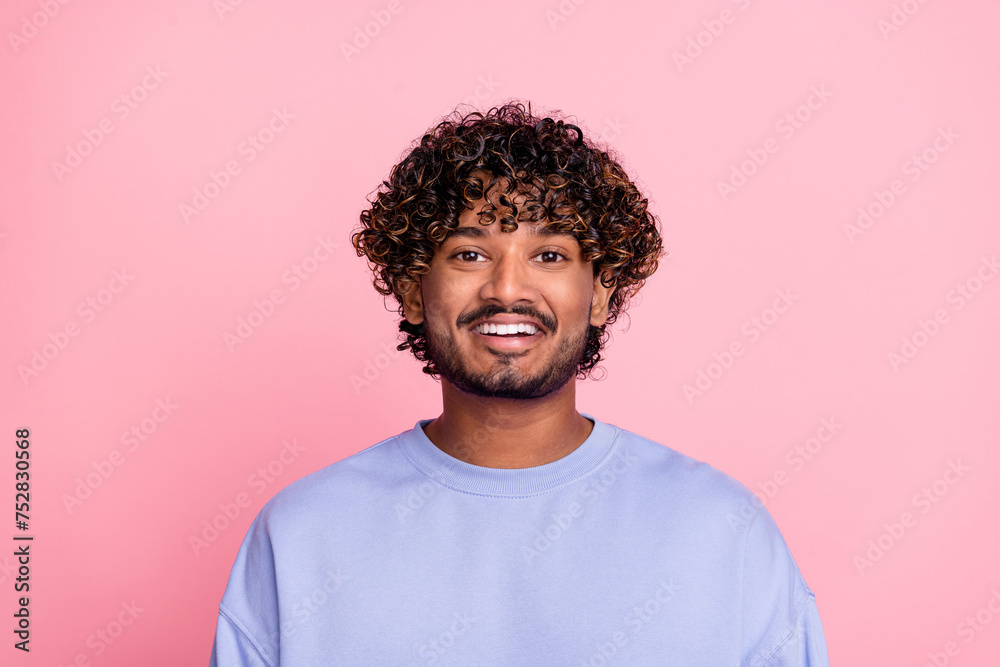 Fototapeta premium Photo of cheerful glad bearded man toothy smile afro curls dressed blue trendy clothes isolated on pink color background