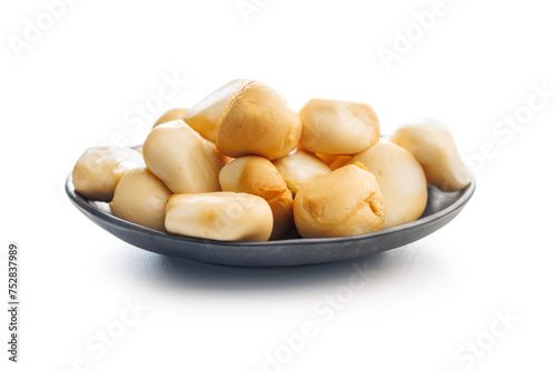 Smoked mini scamorza cheese. Traditional italian cheese on plate isolated on white background.