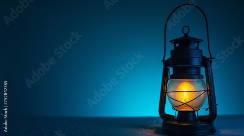 A flickering lantern sitting on a wooden table, casting a warm glow against a calm blue background