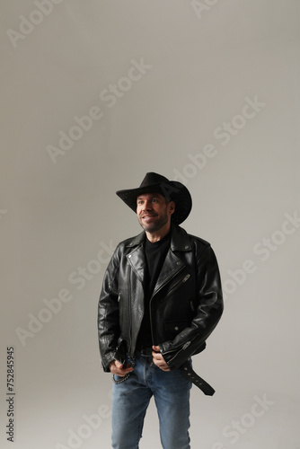 Vertical portrait of smiling mature man wearing hat and posing indoor. Isolated. © face_reader_img