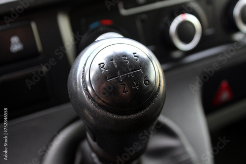 Manual gear shifter. Manual gearbox in the car. Manual gearbox handle. Six speed gear stick in car.