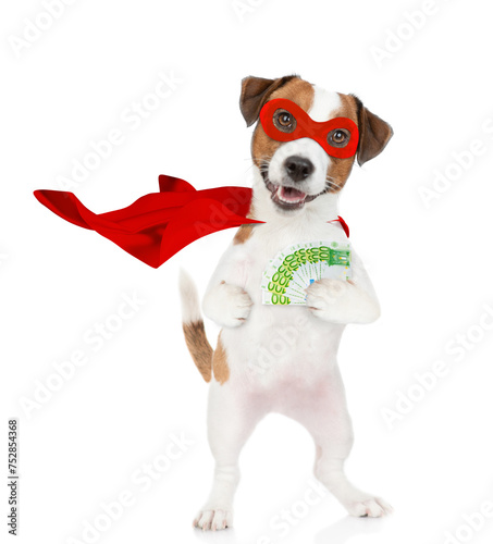 Funny jack russell terrier puppy wearing superhero costume shows Euro. Isolated on white background © Ermolaev Alexandr