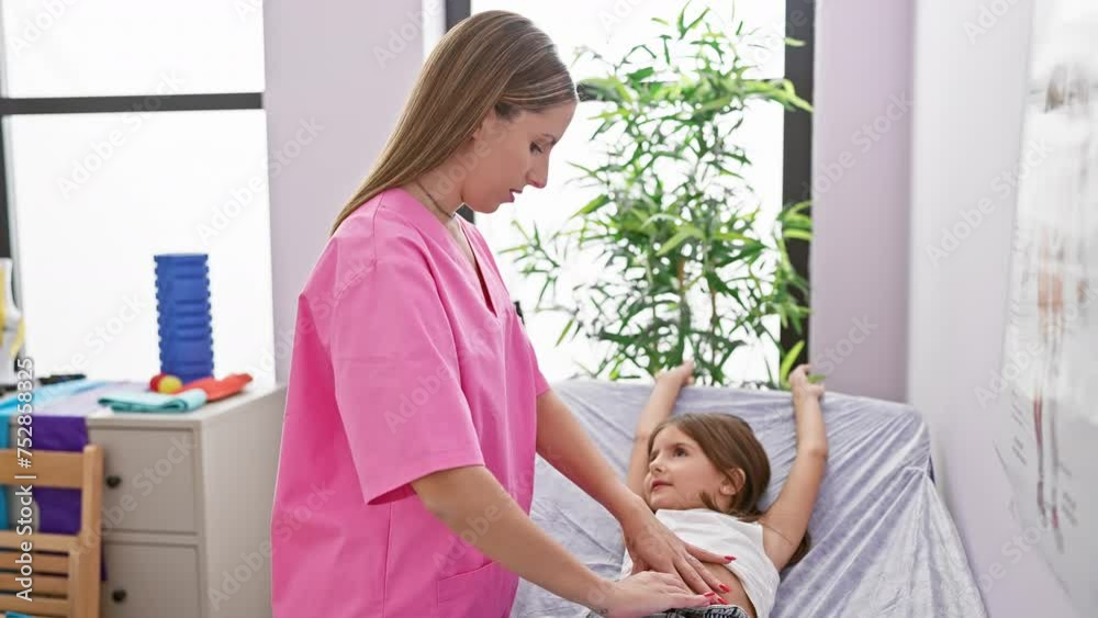 A female pediatrician examines a young girl in a well-equipped, modern clinic with calm and professional demeanor. A female pediatrician examines a young girl in a well-equipped, modern clinic with calm and professional demeanor.