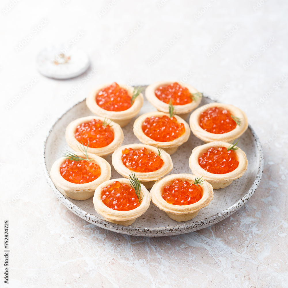 Red caviar served in tartlets Red caviar served in tartlets