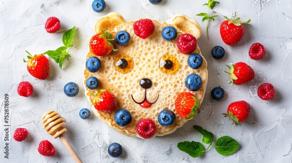 Adorable bear face pancake with berries and honey on white background, copy space available for text Adorable bear face pancake with berries and honey on white background, copy space available for text
