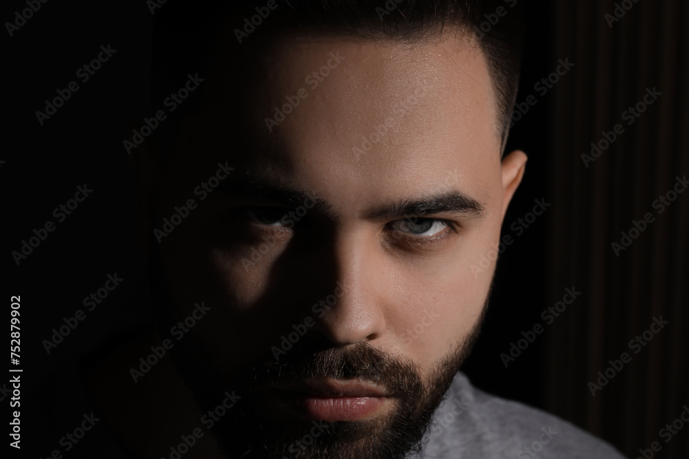 Evil eye. Man with scary eyes on black background Evil eye. Man with scary eyes on black background