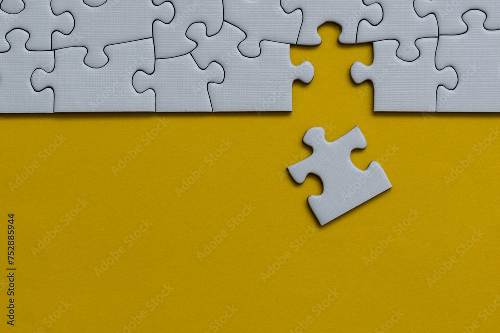 Fototapeta premium Finishing puzzle assemble with the last one - missing puzzle piece