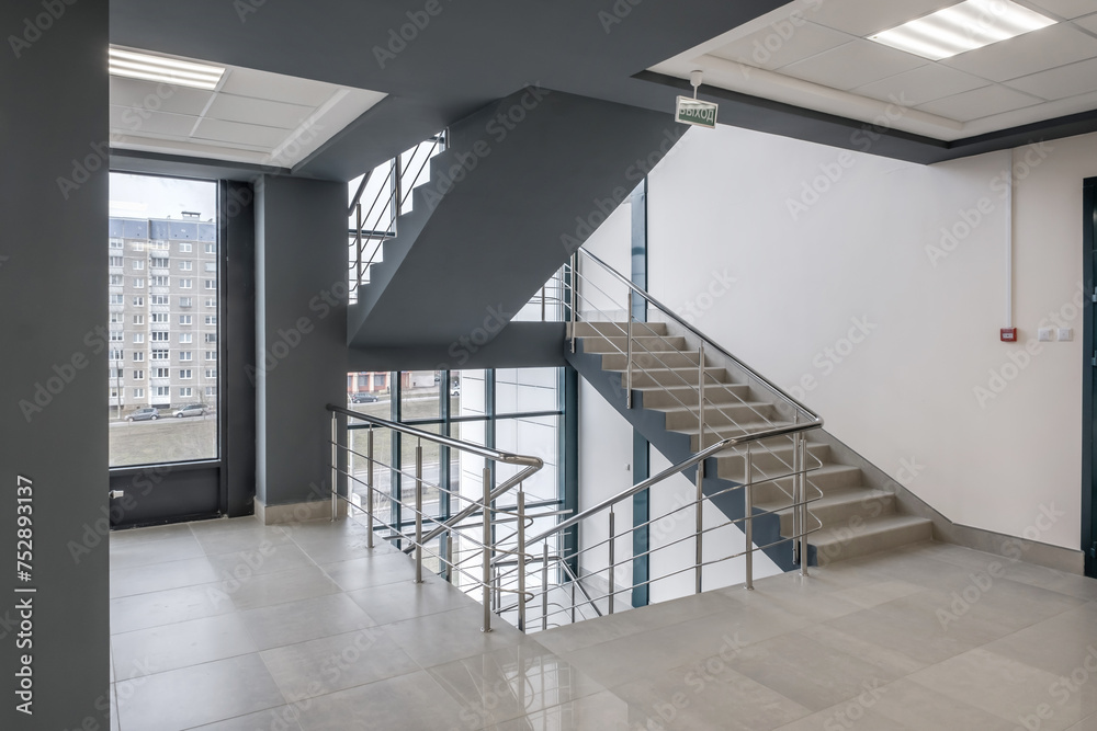 Fototapeta premium stairs emergency and evacuation exit stair in up ladder in a new office building.