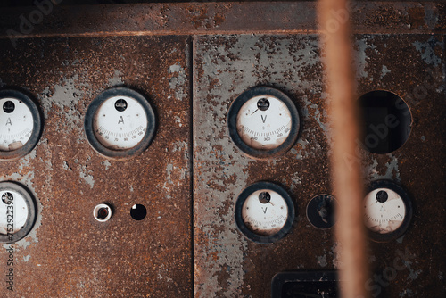 rusty metal with old broken gauges in a shady room