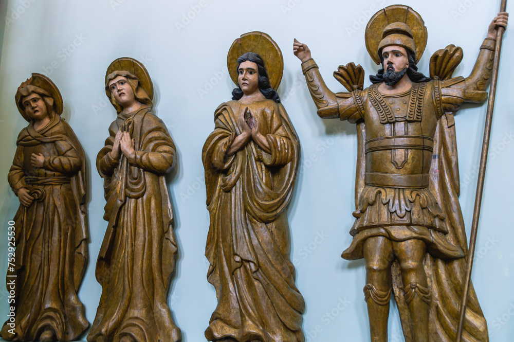 Obraz premium Perm wooden sculpture. Decorations from the temple. Carved saints made of wood. Ancient sculptures in the church. A place for the priest to pray. Ancient masterpieces of wooden architecture.