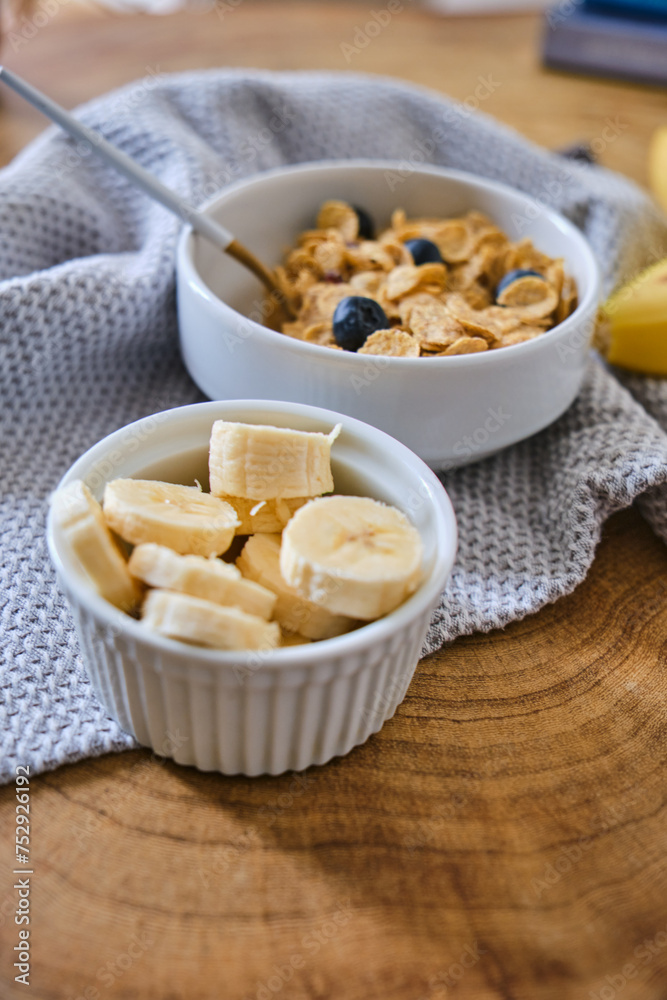 Smoothie bowl with banana, blackberries and muesli on wood table. Healthy eating, healthy lifestyle Smoothie bowl with banana, blackberries and muesli on wood table. Healthy eating, healthy lifestyle