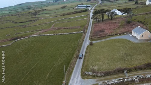 aerial view of car driving along a country road, Ireland
